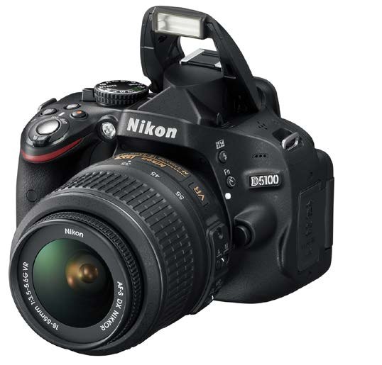 Nikon D5100 DSLR with kit lens and pop-up flash raised