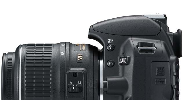 Side profile of an entry-level DSLR showing body controls and kit lens