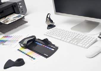 A colour-management workstation: printer, calibrated monitor, and colour swatches