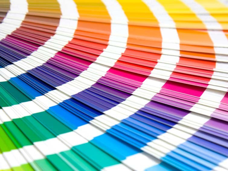 A fanned-out deck of printed colour swatches